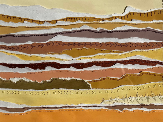 Long strips of gouache painted paper, torn, and hand sewn using a variety of hand embroidery stitches, in a 16"x20" white frame, matted to 11"x14" to display this mixed media piece. 